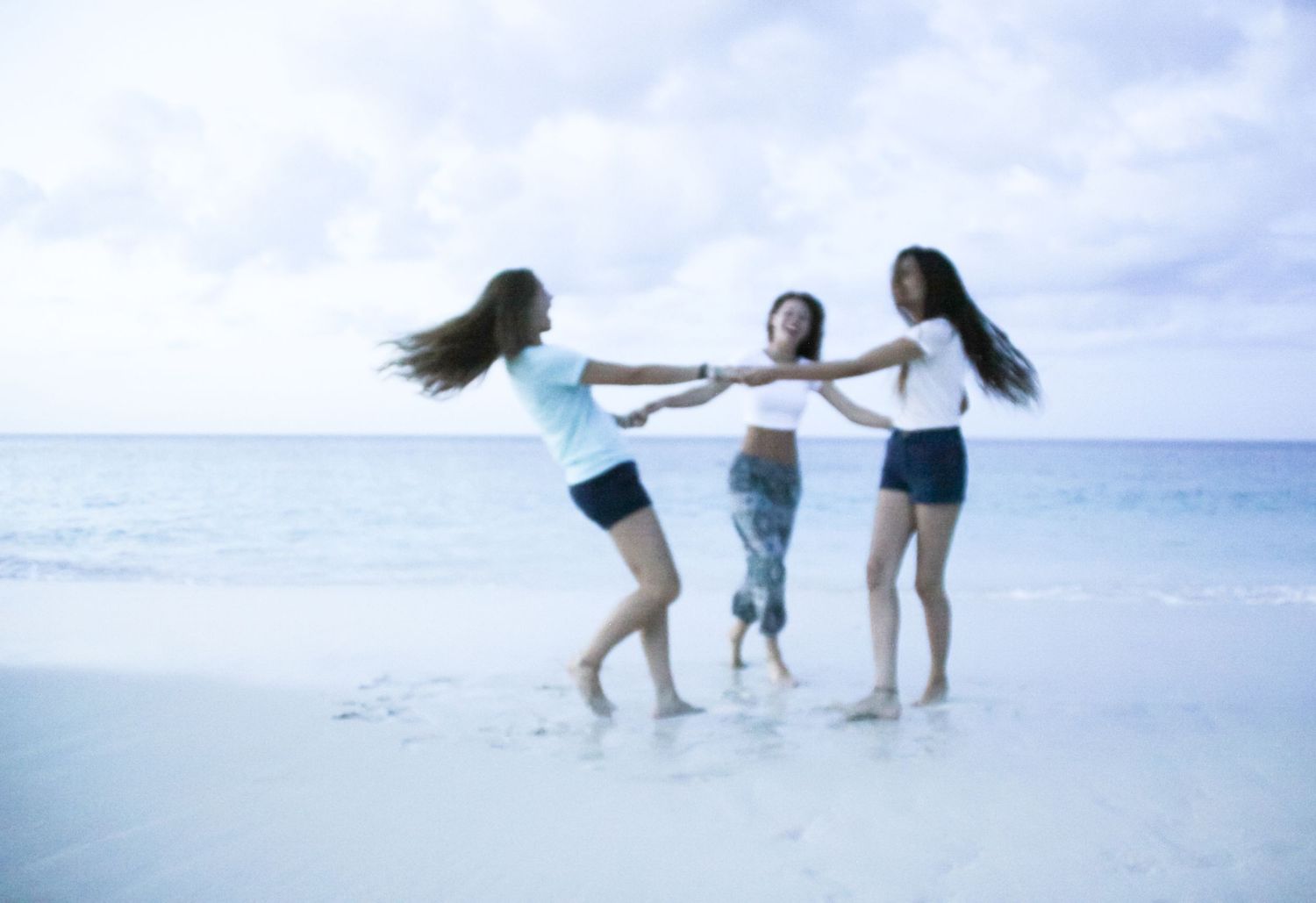 girls playing on the beach