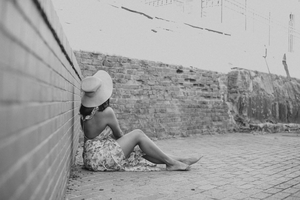 girl poses at riverfront park with hat in columbia, sc