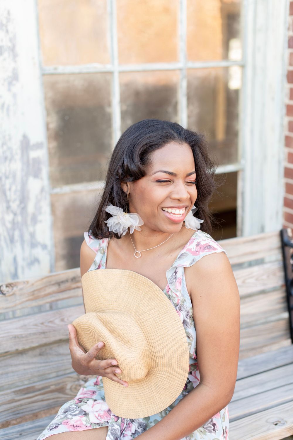 Girl  laughing on a bench at Riverfront park in columbia, sc