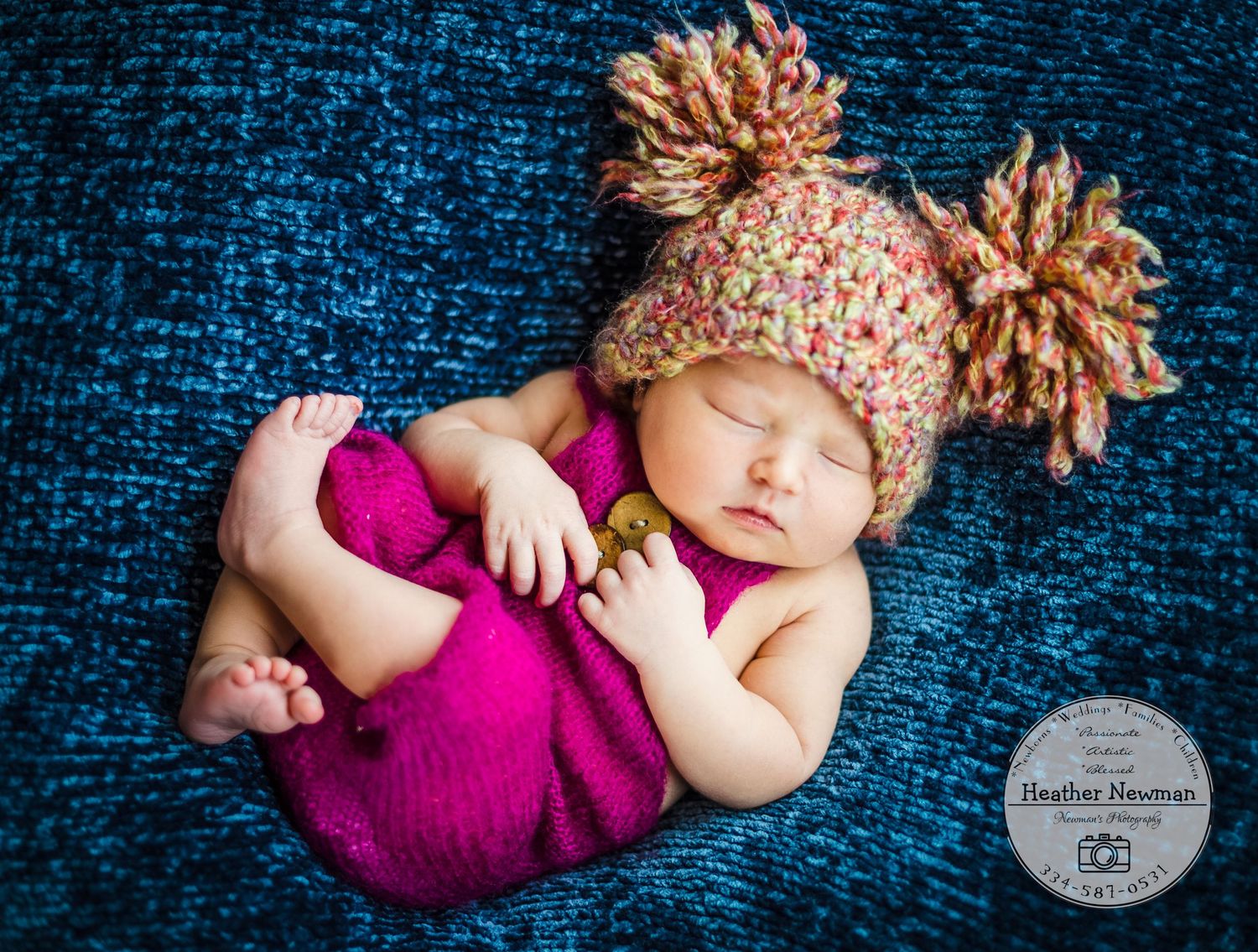 newborn baby girl pose natural light photography studio session wraps and headband and custom creative set memory captured smile Alabama