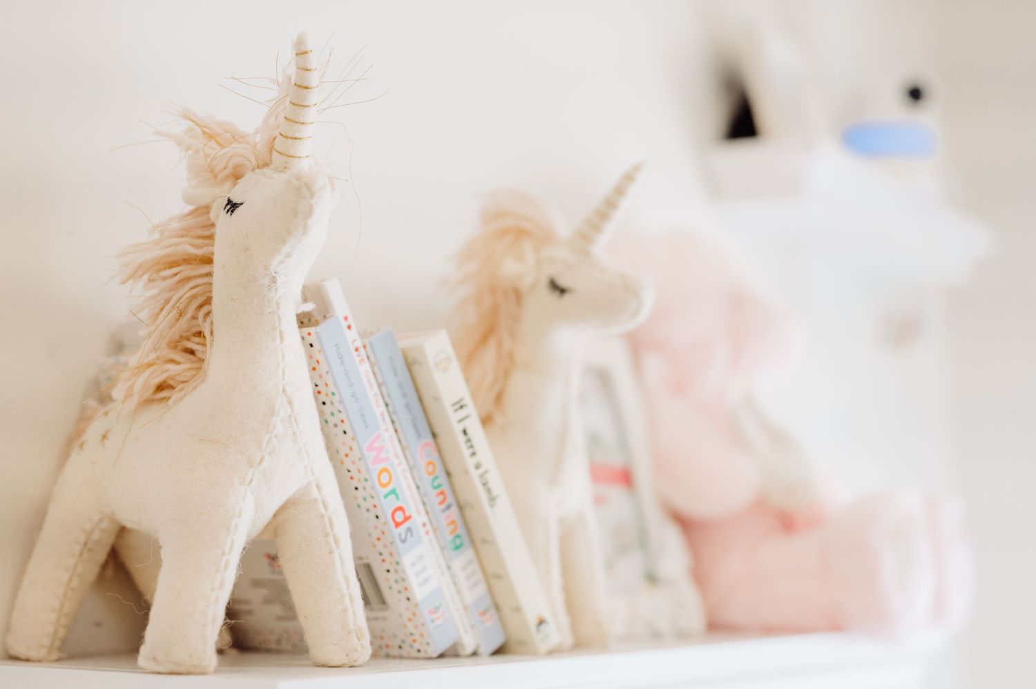 light and bright decorations of the nursery during a in home newborn lifestyle session in west university in houston tex