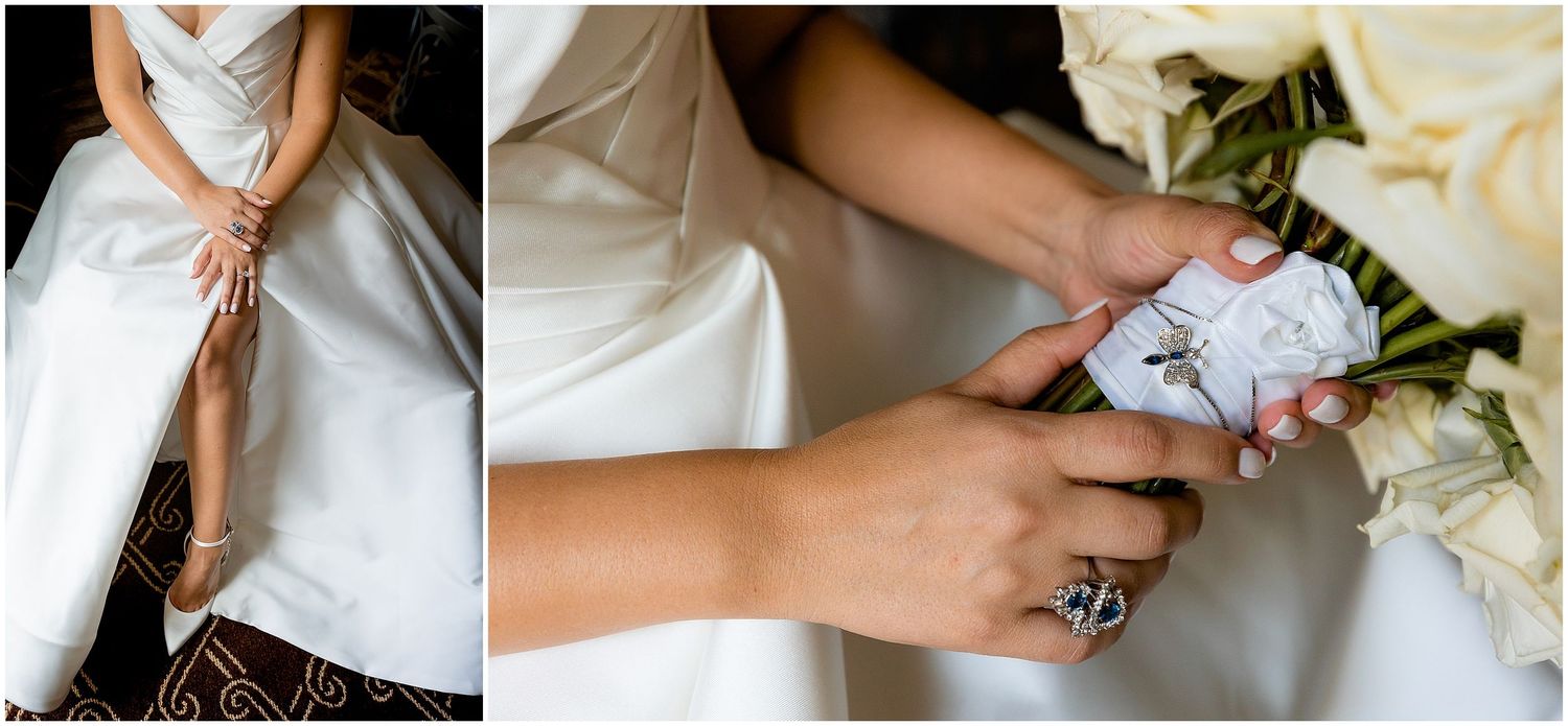Wedding dress and accessory details with white roses and delicate jewelry.