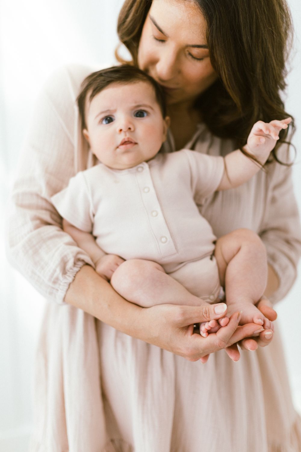 Gentle embraces and cuddles showcased in a bright studio setting.