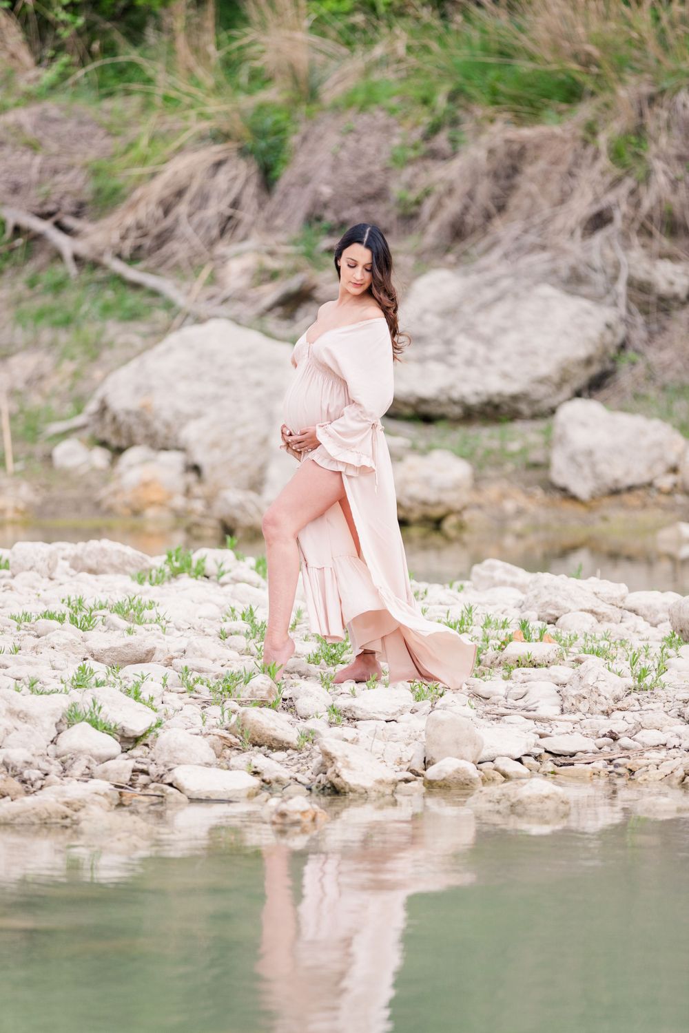maternity portrait on limestone rock island with water reflection