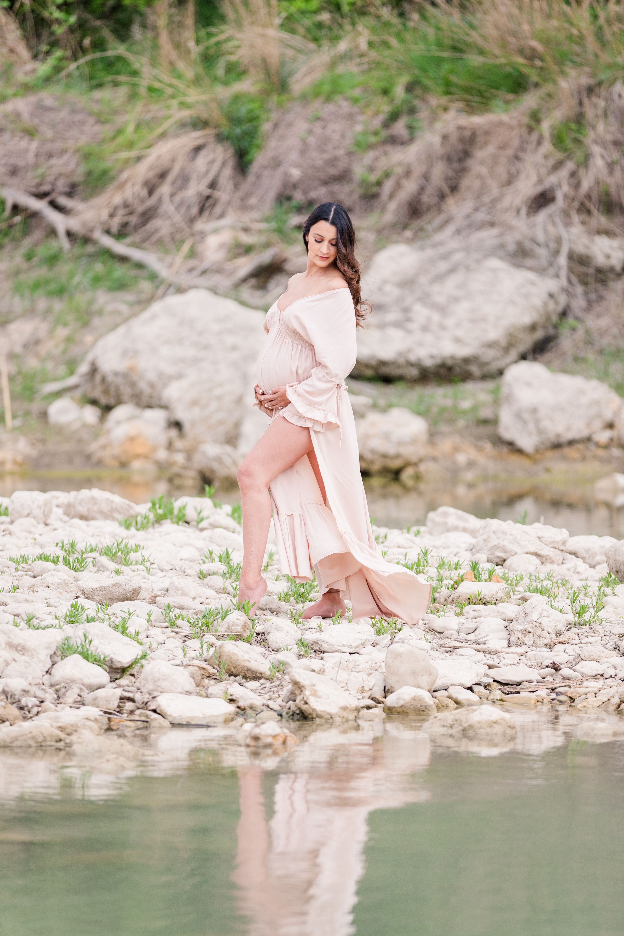 maternity portrait on limestone rock island with water reflection