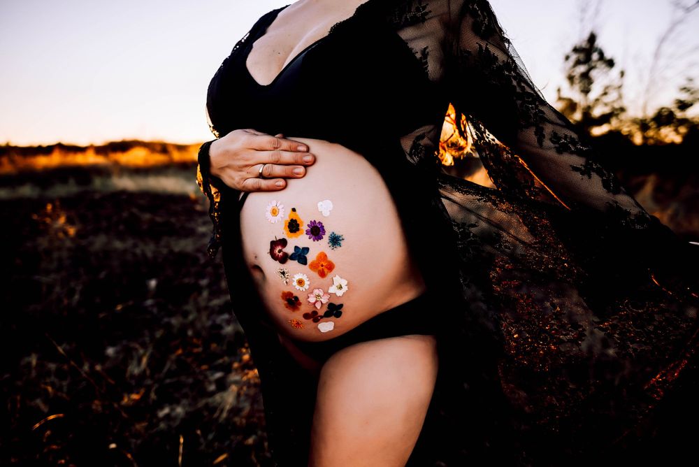 Delicate floral temporary tattoos decorating skin during an outdoor photoshoot.