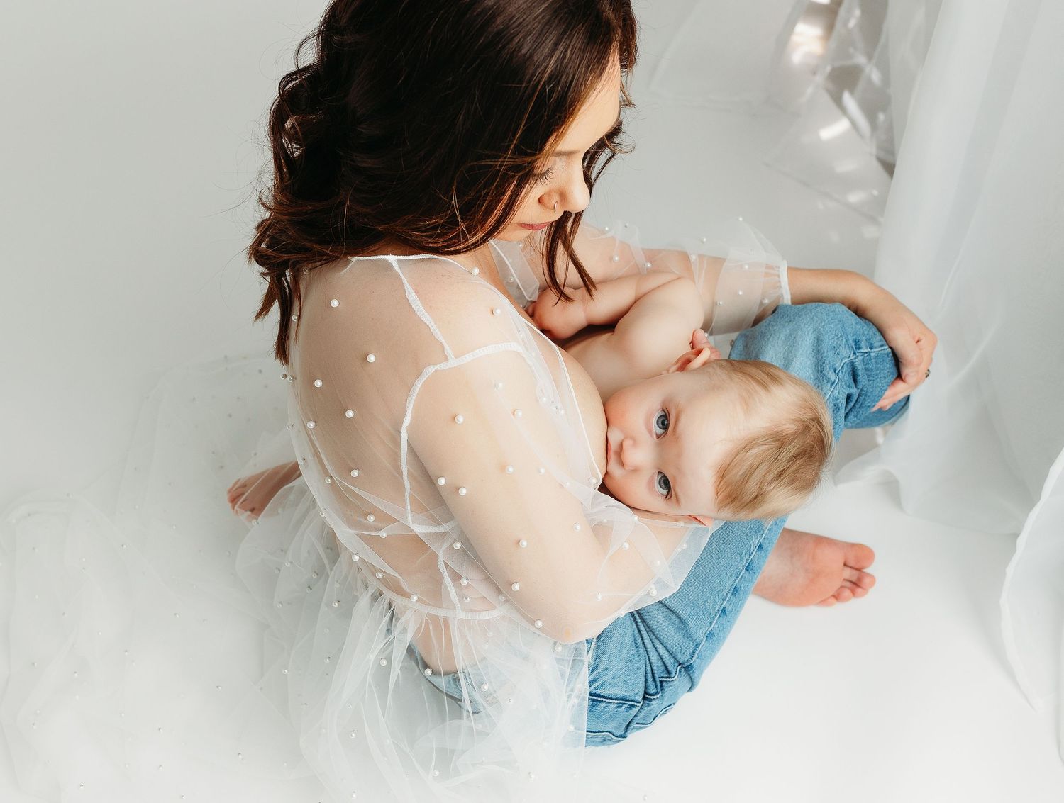 Mom is breastfeeding daughter. Greenville sc newborn photographer, Easley sc newborn photographer, Upstate newborn photographer.