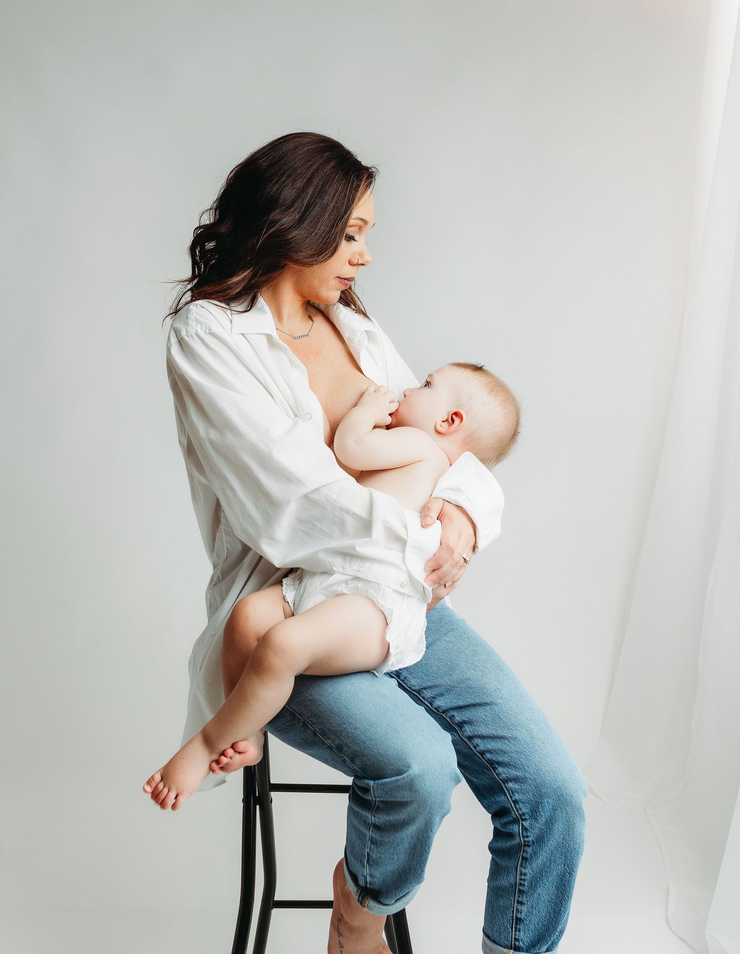 Mom breast feeding baby girl. Greenville sc newborn photographer, Easley sc newborn photographer, Upstate newborn photographer.