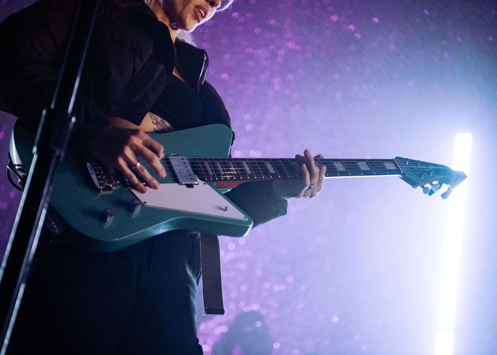 Cropped view of Lights playing guitar