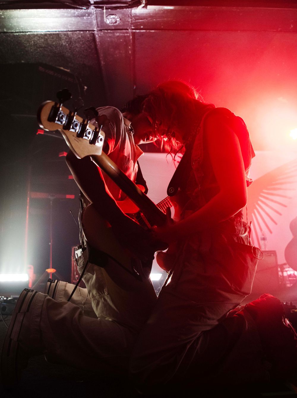 Upsahl and her guitarist kneeling facing each other
