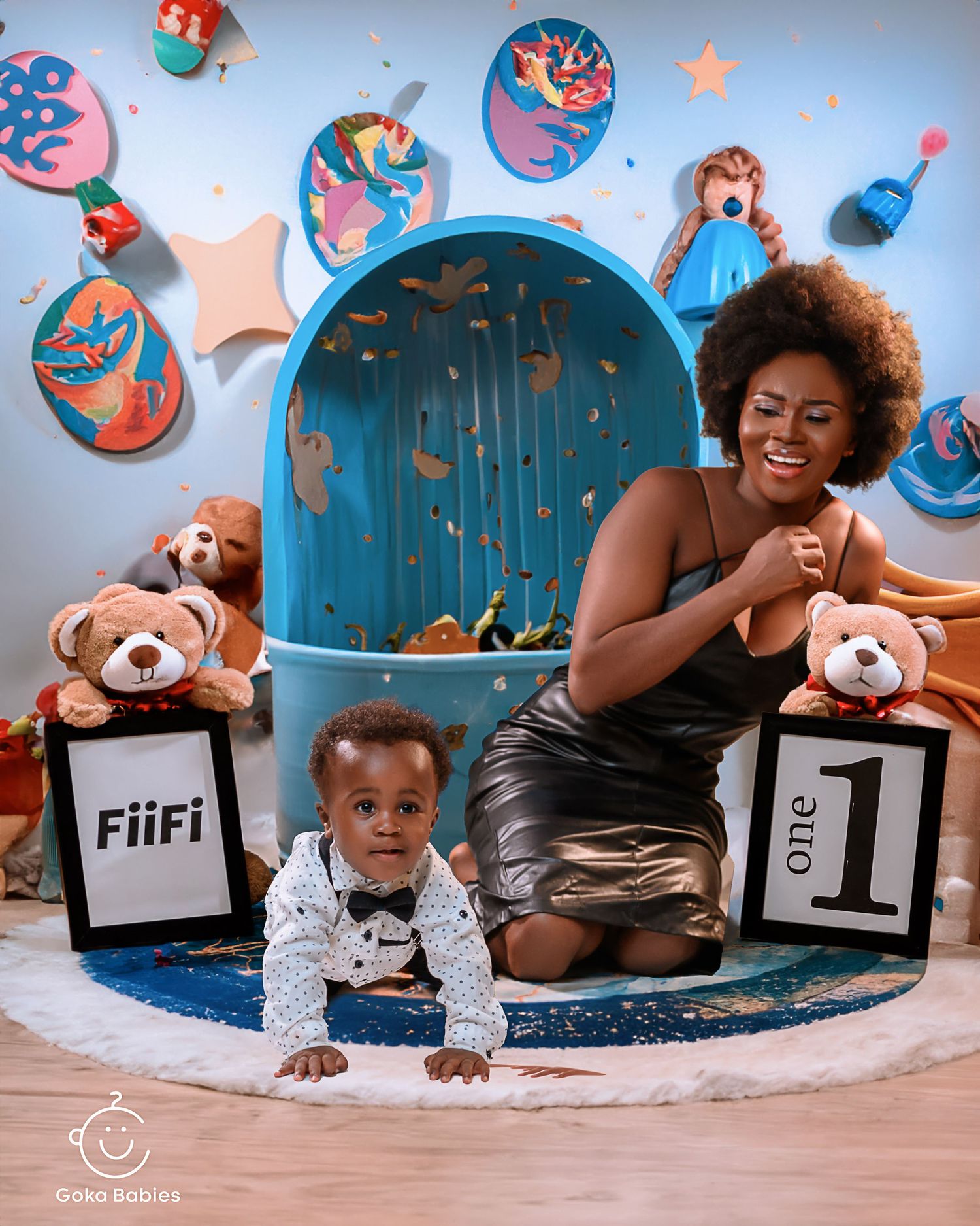 Birthday celebration scene with blue archway and teddy bears on decorative floor mat.