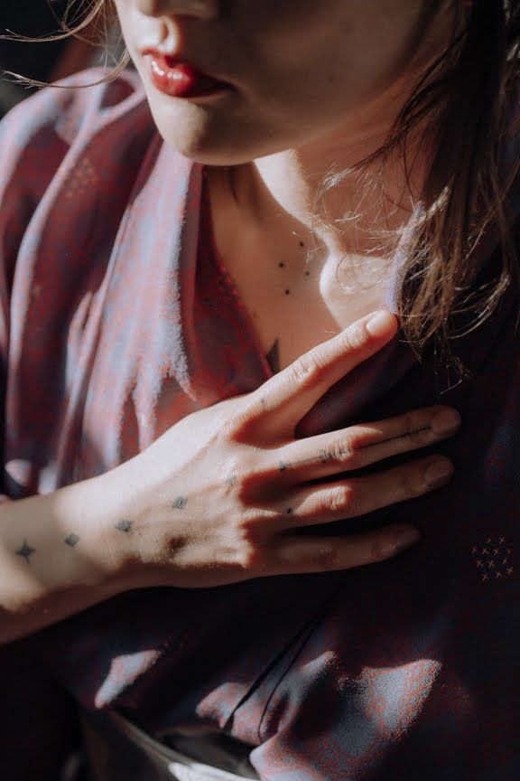 miniature tattoos on the woman's wrist