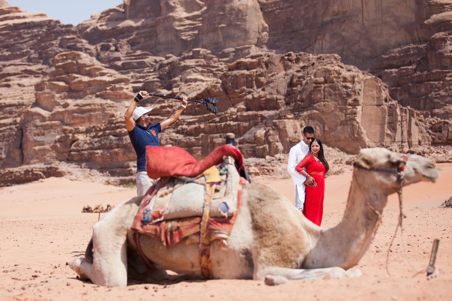Sher lights up the couple for Shital in the Wadi Rum Desert in Jordan. That camel really stank!