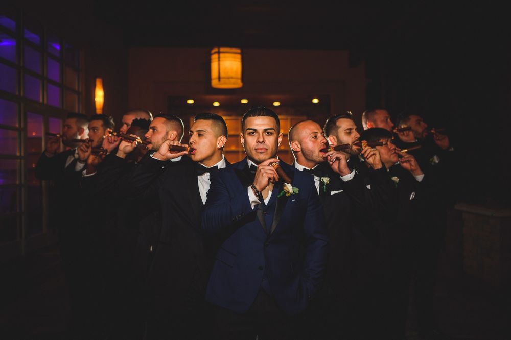 groomsman wise guy portrait with cigars at stone house