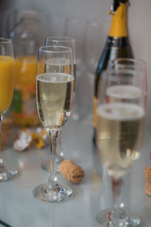 Glasses of prosecco and bottle of prosecco.