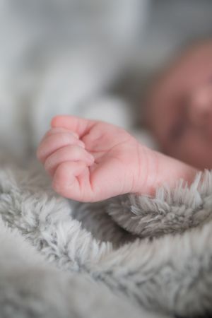 Close up of a newborn babys hand.