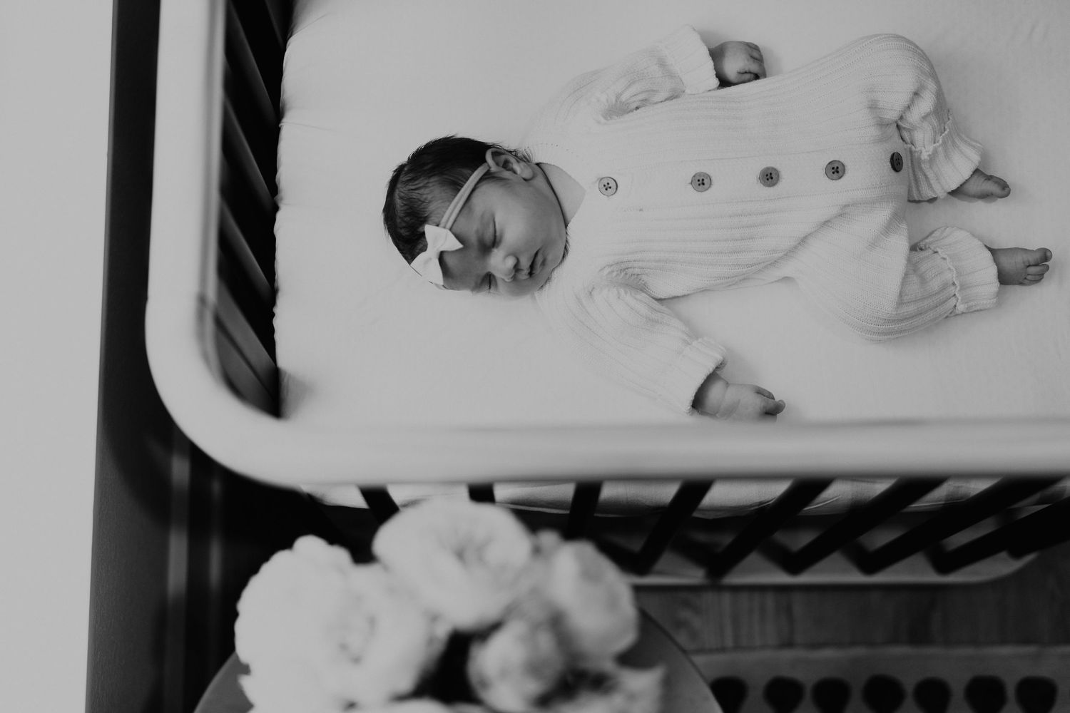 newborn baby sleep in bassinet infront of window. newborn photoshoot at home dallas.