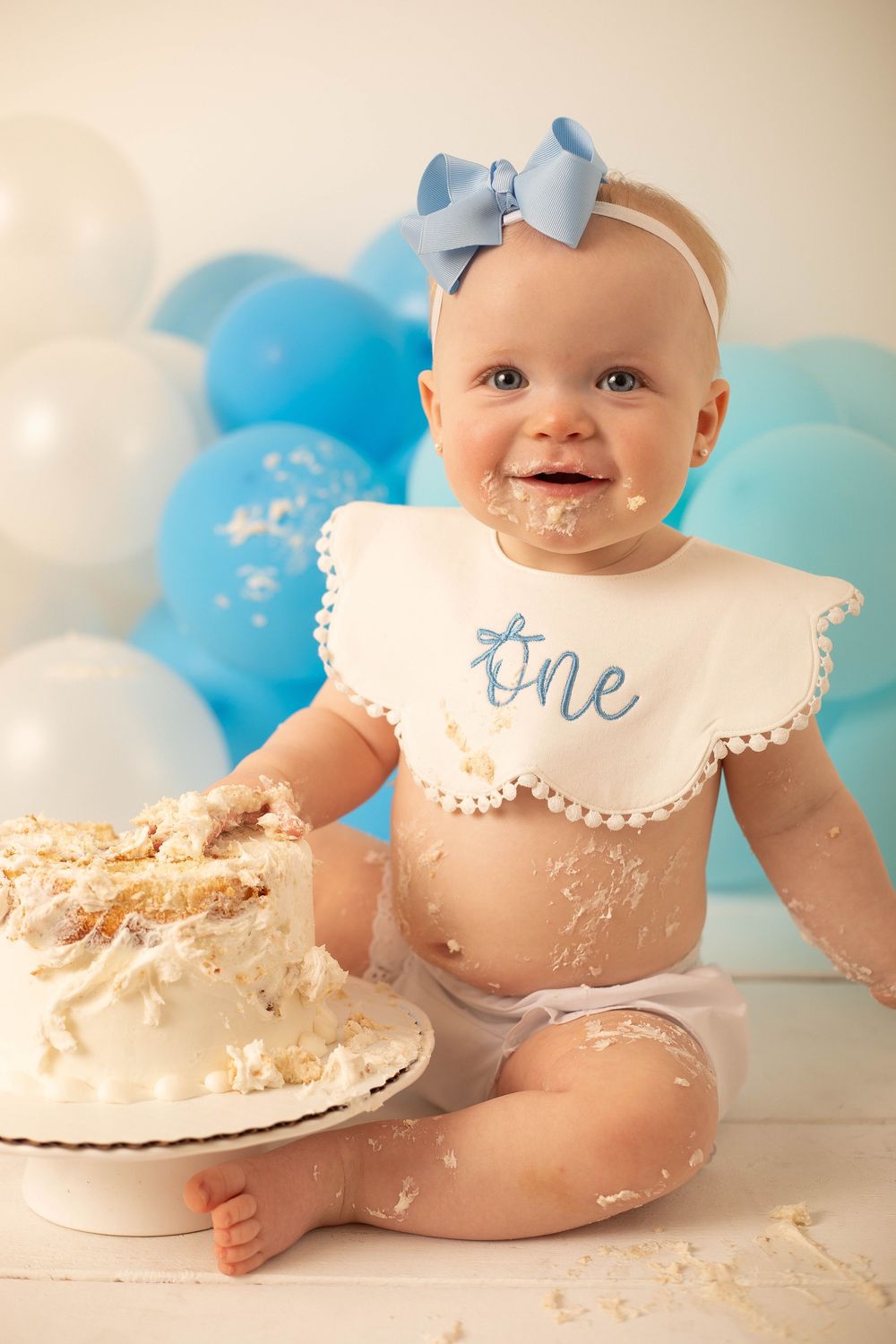 Baby girl enjoying a sweet cake smash session in Central Louisiana