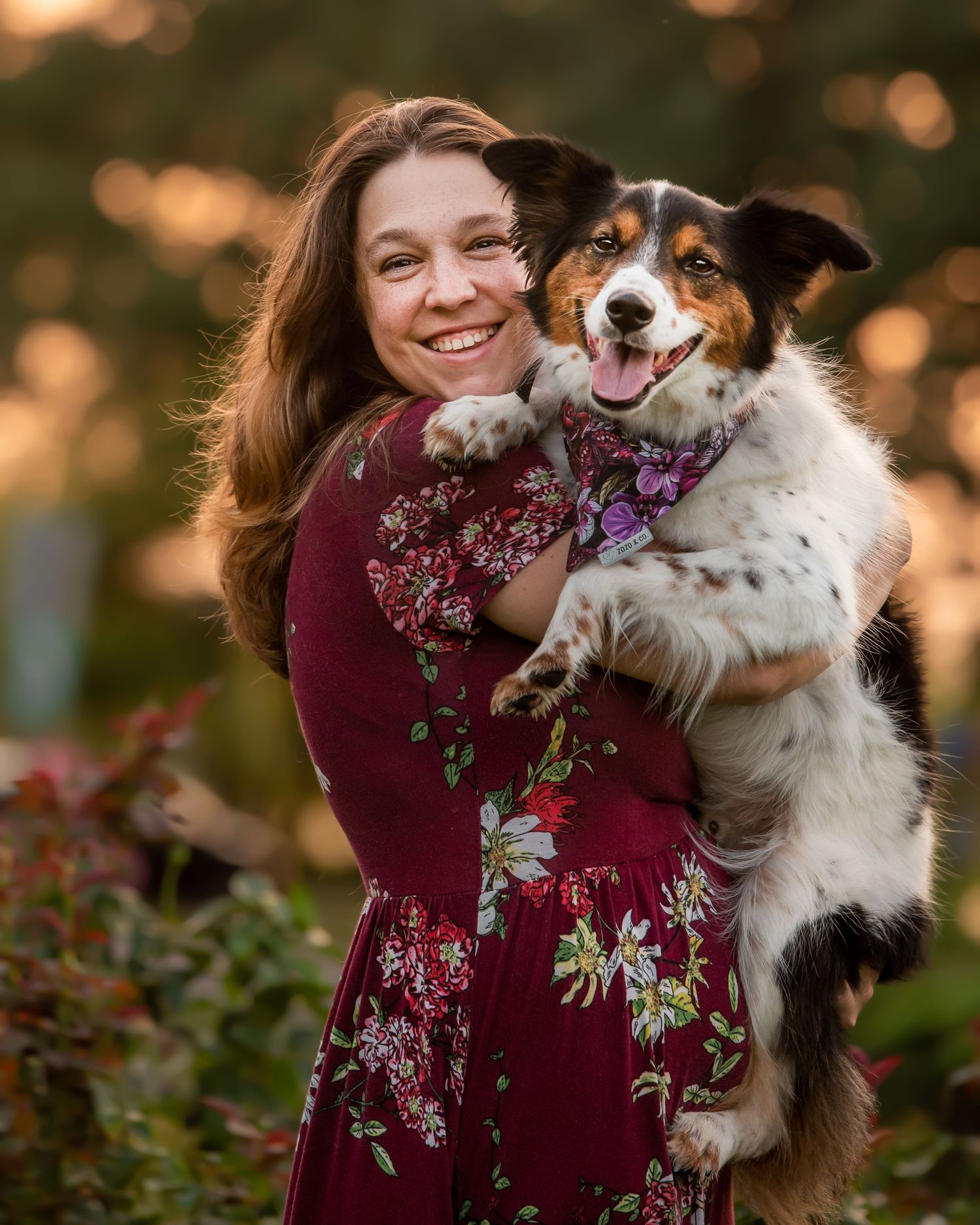 woman holding her dog
