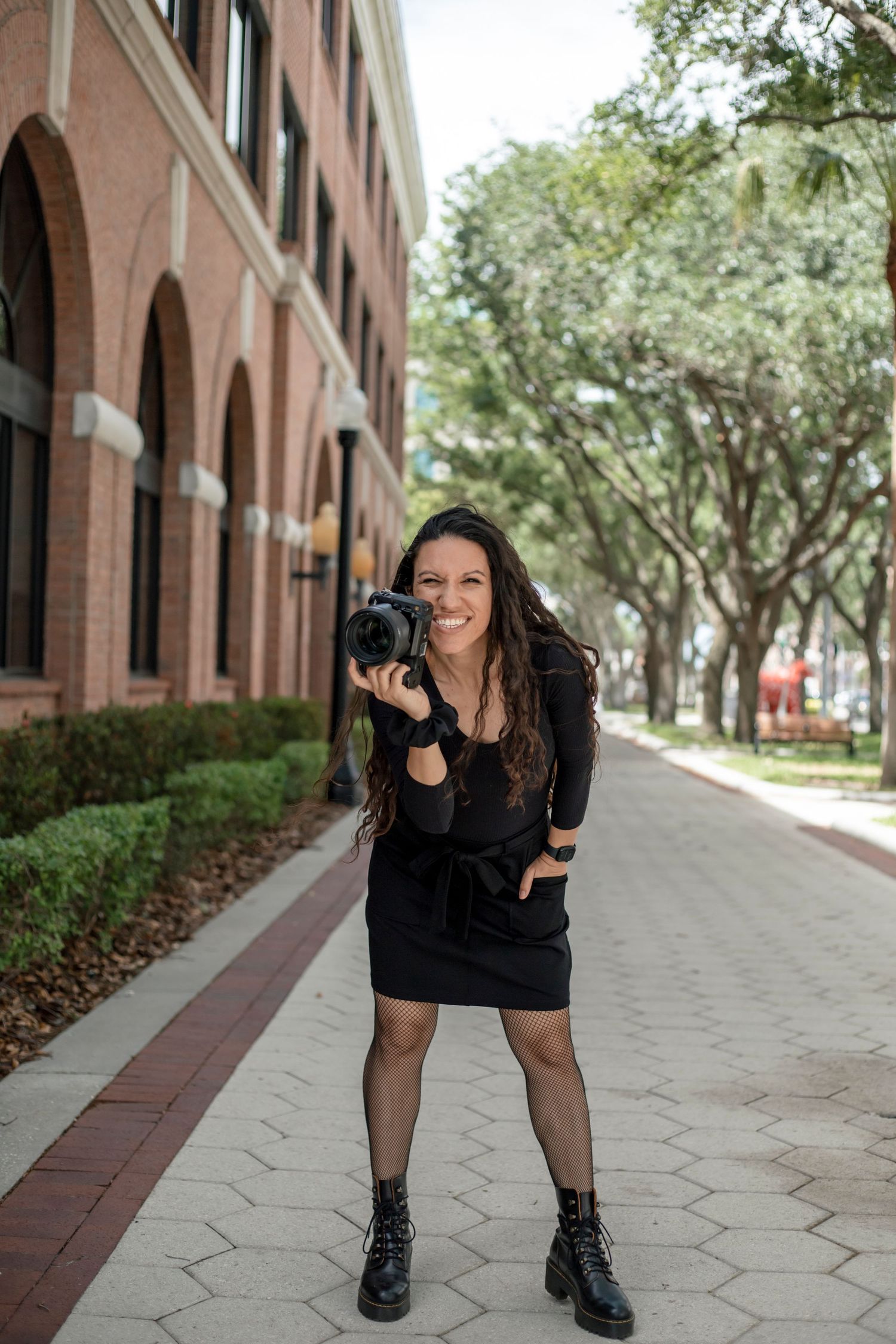 Girl posing with camera in hand!