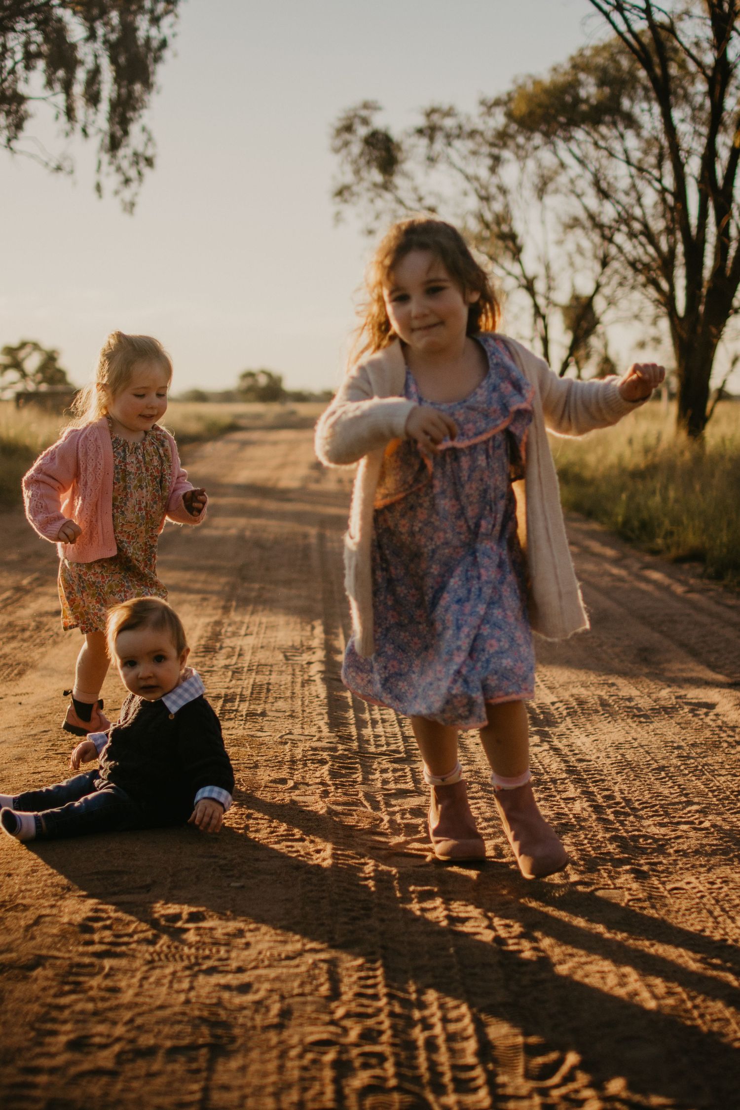 Kids playing on a dirt road