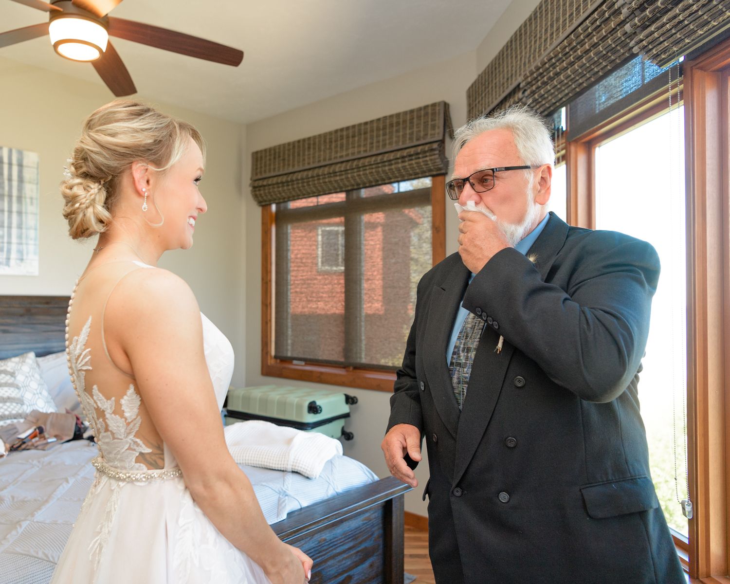 Touching first look reaction captured in indoor setting with natural window lighting.