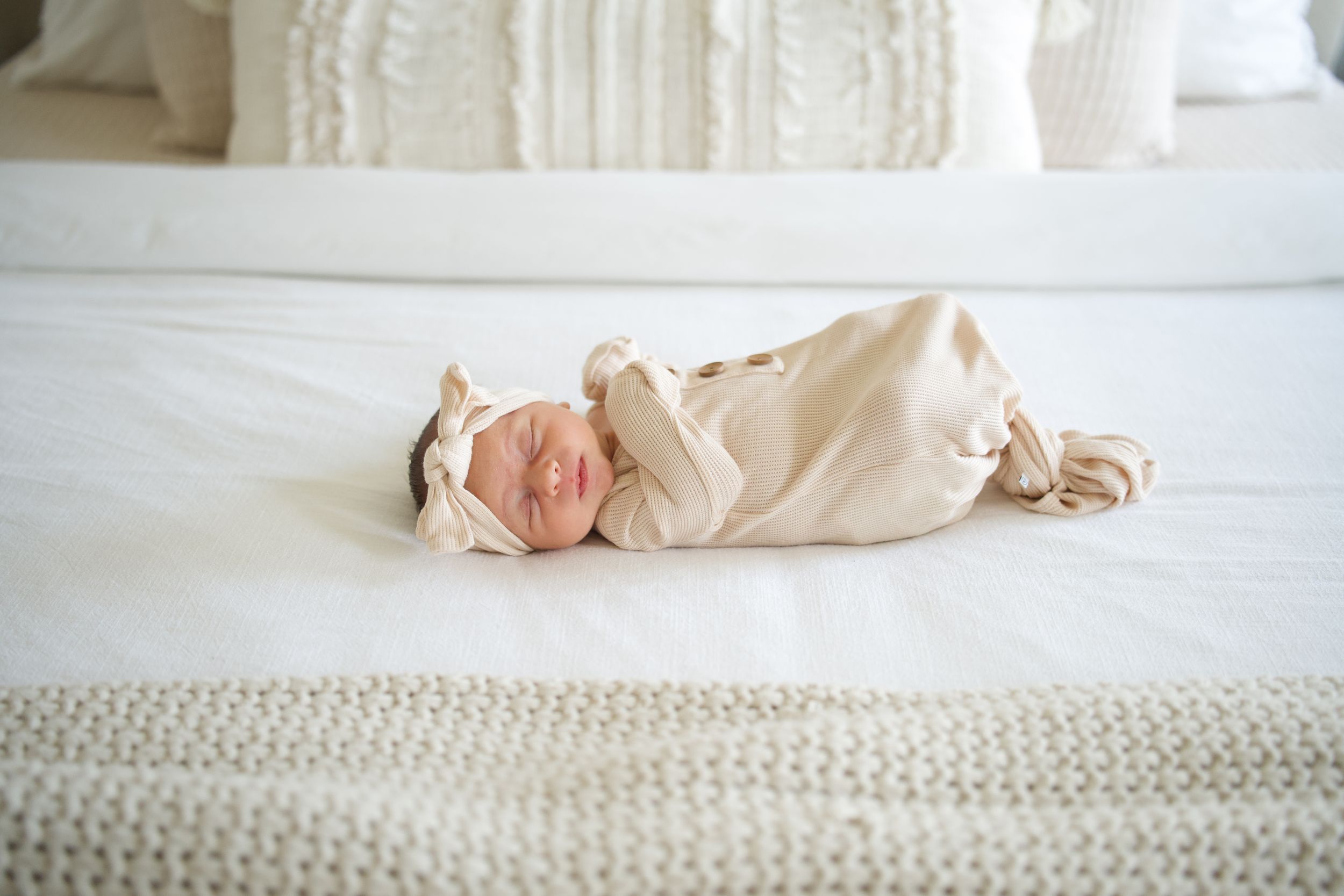 A series of white bedding and mattress close-up shots showing different textures and folds in soft fabric.