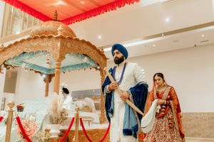 Ornate wedding ceremony under decorative canopy with traditional Sikh ceremonial details.