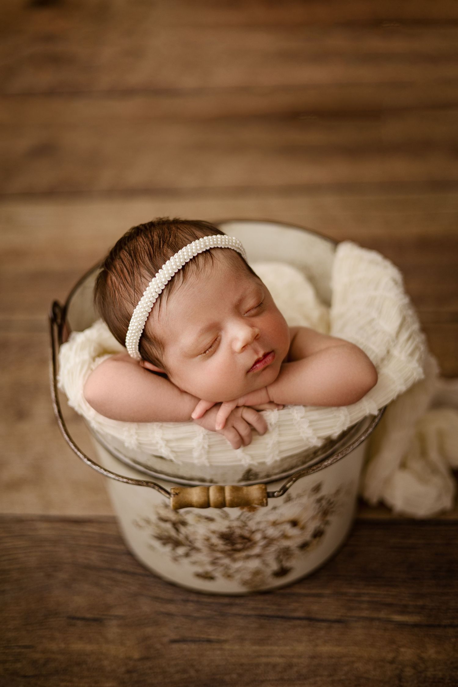 Newborn photography in Magnolia TX featuring timeless posed newborn portraits in a neutral studio setting