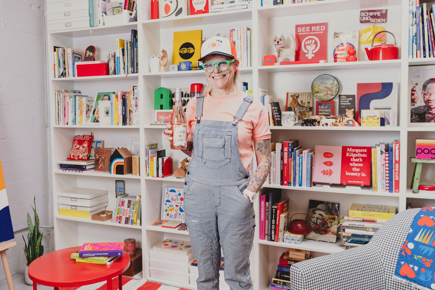 A retail interior with colorful bookshelves displaying books and collectible items.