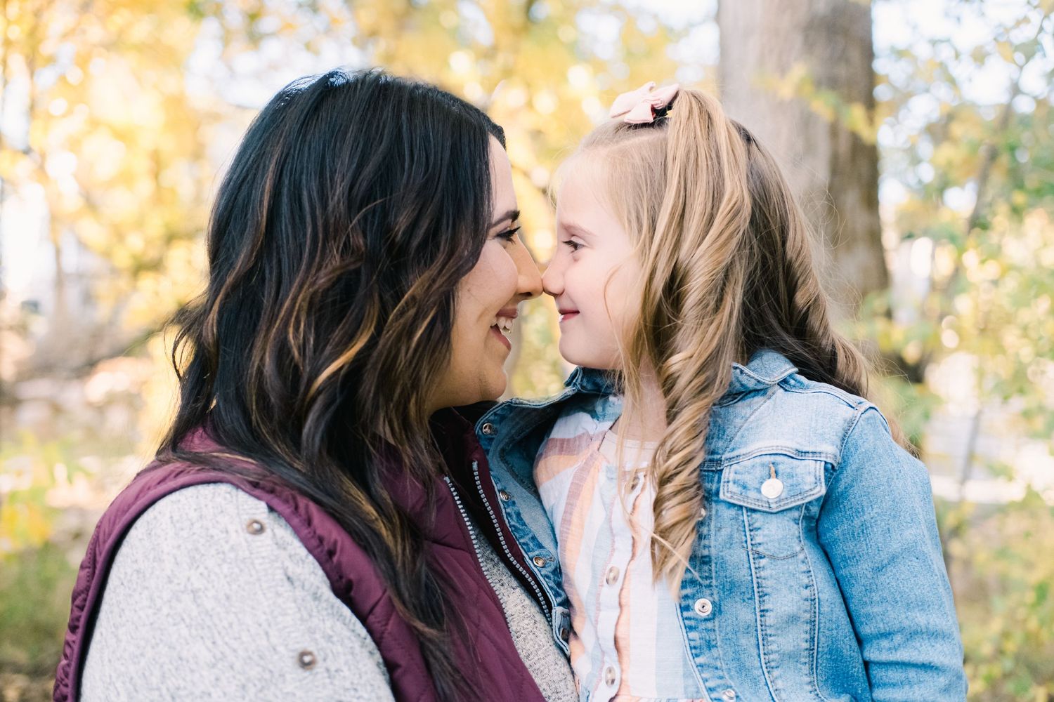 mom and daughter smiling at each other on the Gaily Trail in Kaysville, Utah Davis County.