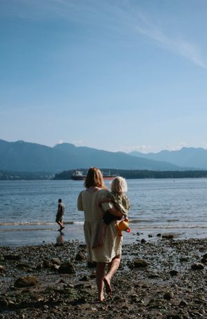 documentary-style family photoshoot for second pregnancy with toddler at the beach in Vancouver, BC