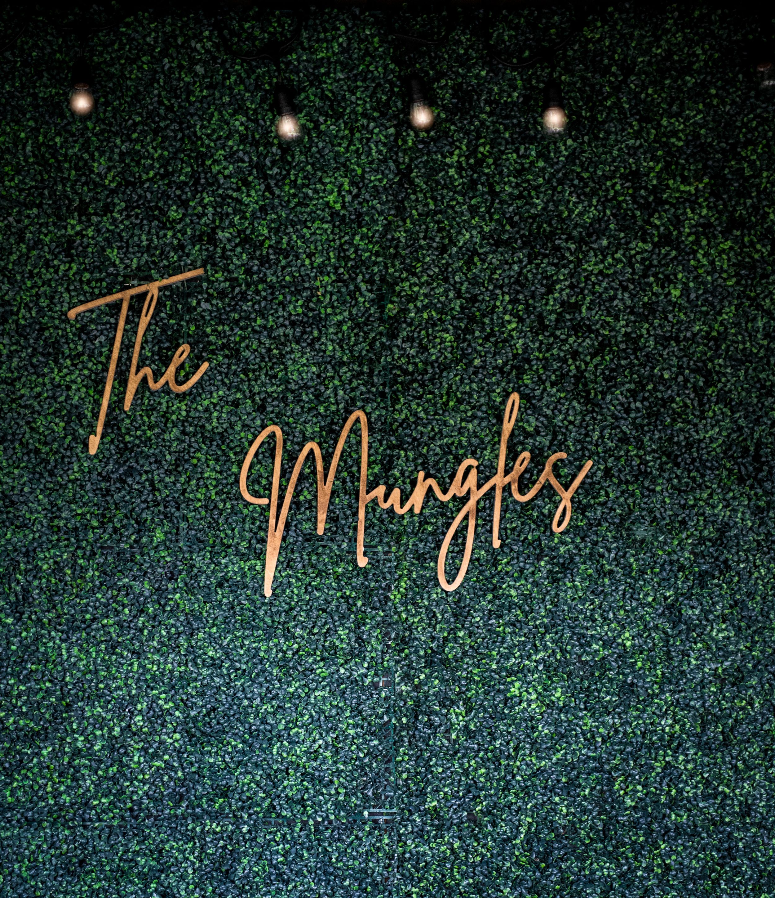 Illuminated script text display against a dark background with sparkly effect.