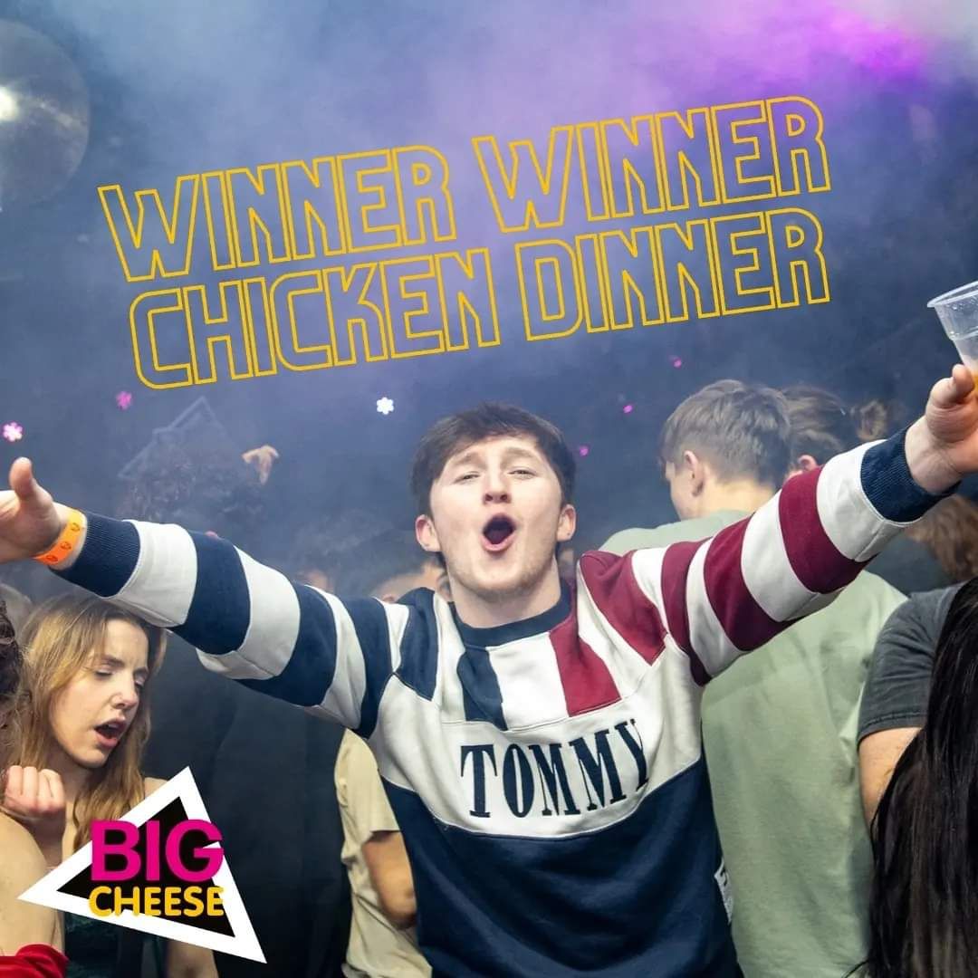 Students celebrating victory with raised arms under neon lights and text.