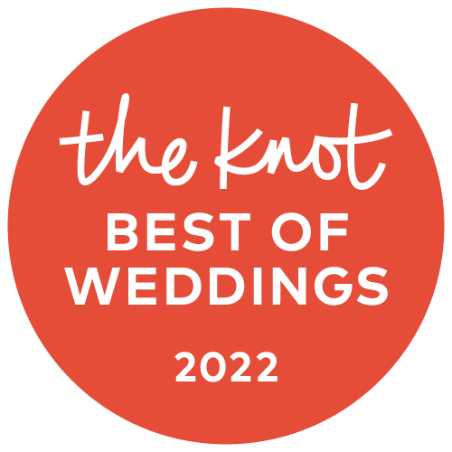The Knot Best of Weddings 2022 award badge in coral red and white circular design.