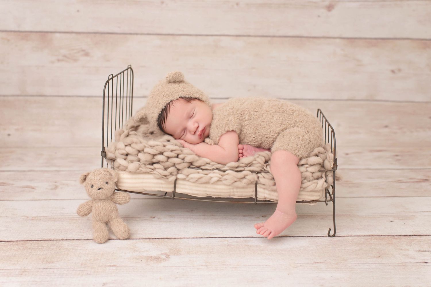 baby boy on bed teddy bear