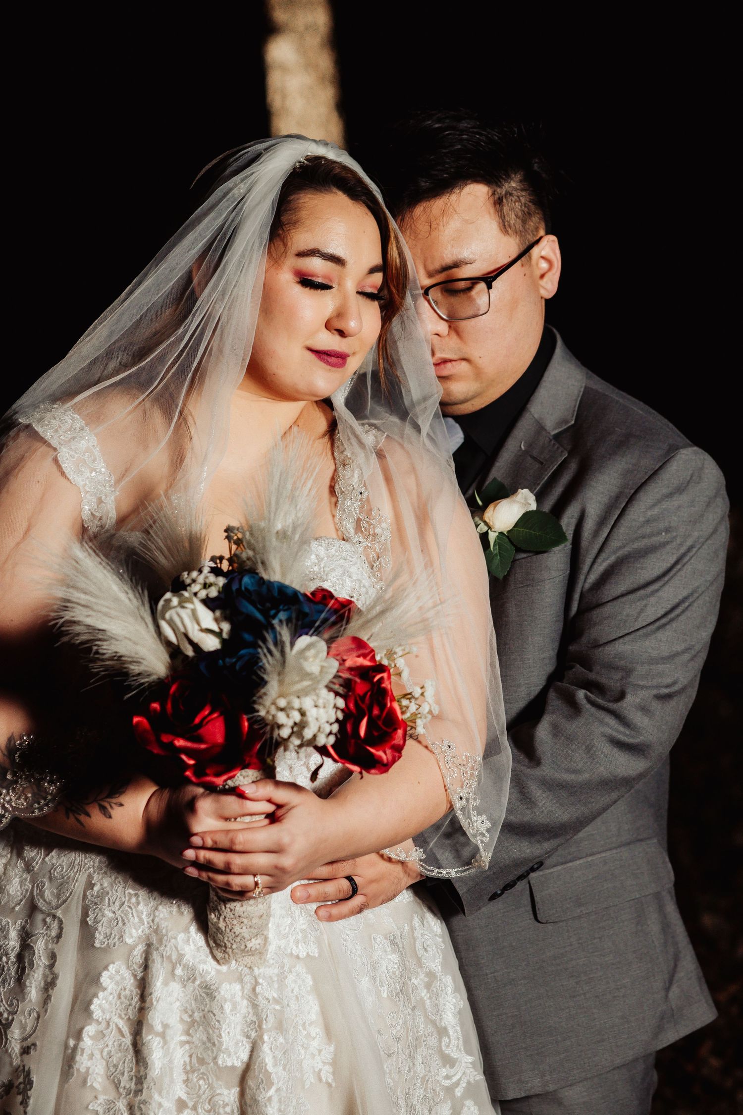 Boho Wedding with White Dress and Grey Suit With Royal Blue and Crimson Flowers at Arrowhead Weddings and Events