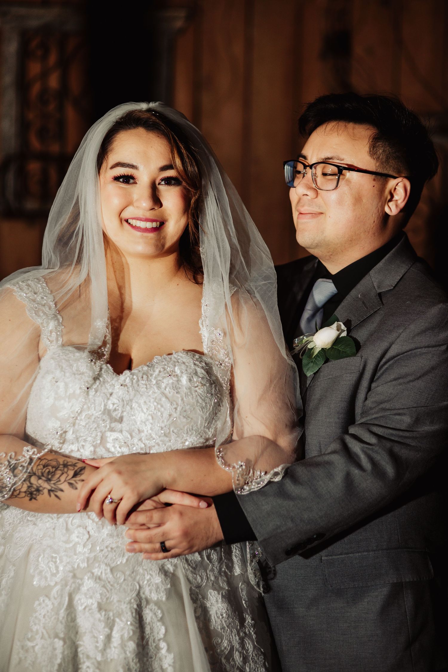 Boho Wedding with White Dress and Grey Suit With Royal Blue and Crimson Flowers at Arrowhead Weddings and Events