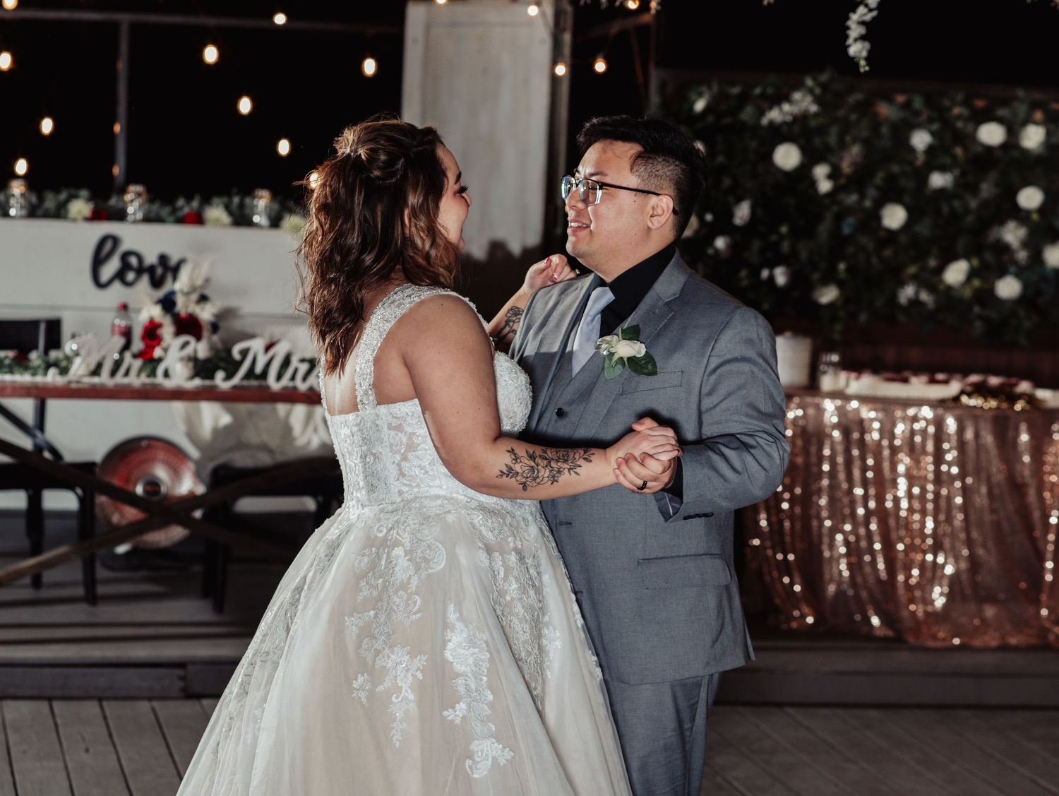 Boho Wedding with White Dress and Grey Suit With Royal Blue and Crimson Flowers at Arrowhead Weddings and Events