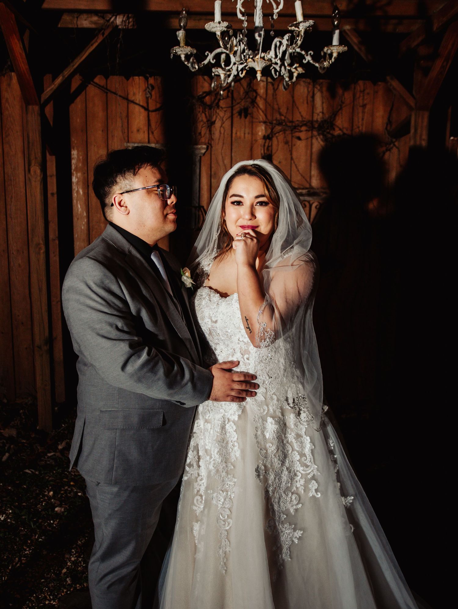 Boho Wedding with White Dress and Grey Suit With Royal Blue and Crimson Flowers at Arrowhead Weddings and Events