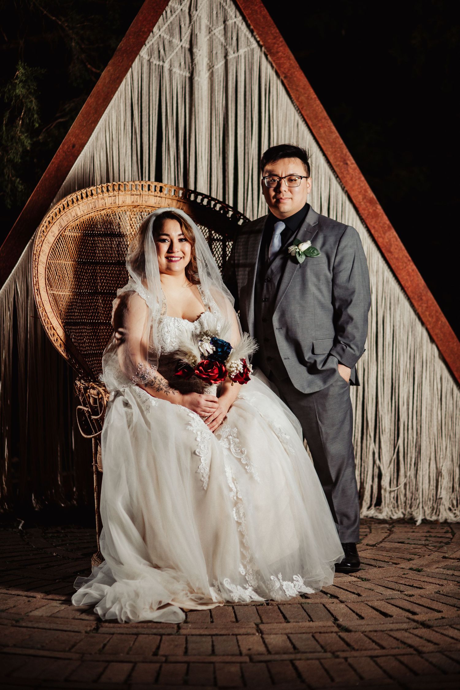 Boho Wedding with White Dress and Grey Suit With Royal Blue and Crimson Flowers at Arrowhead Weddings and Events