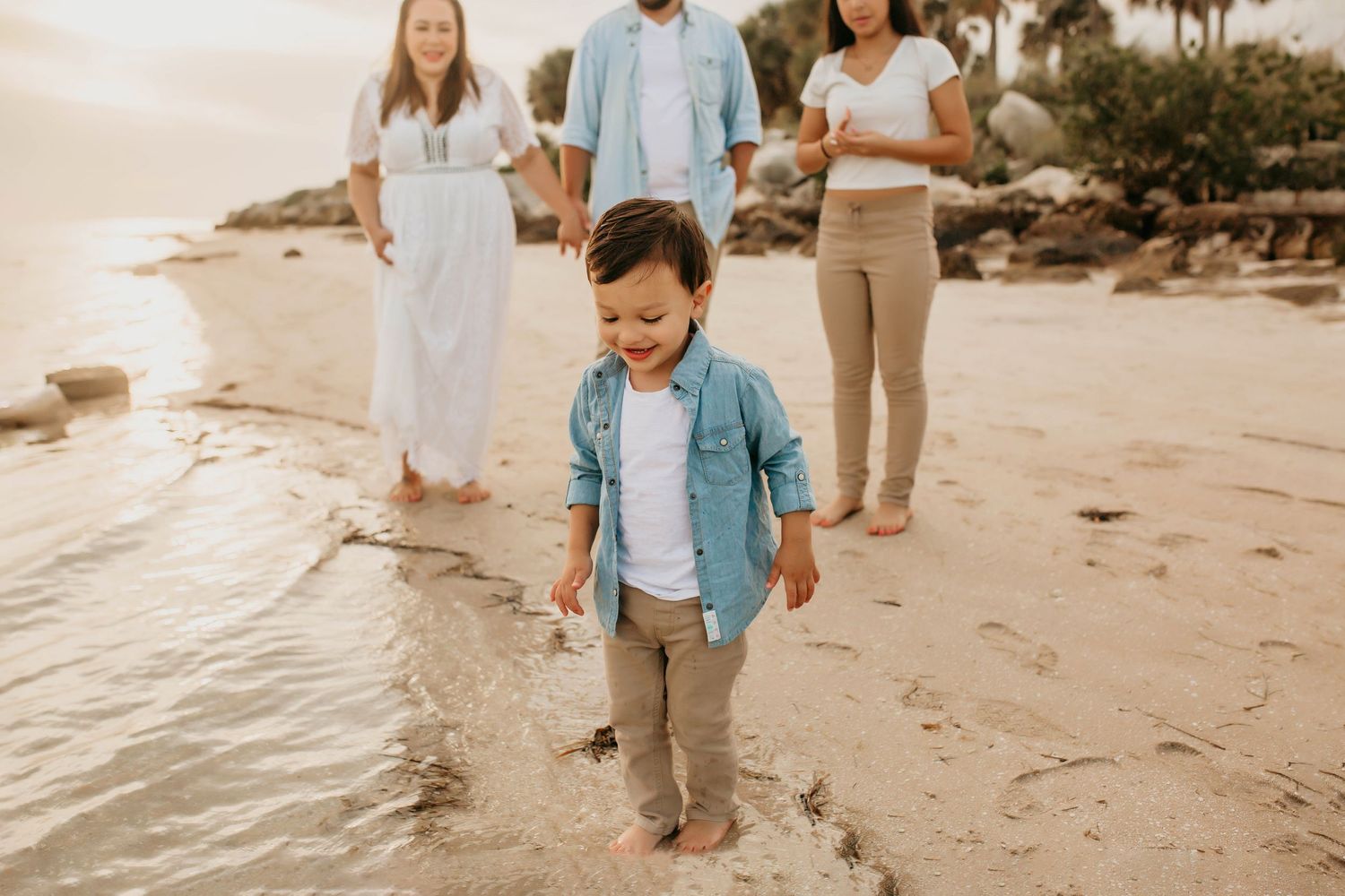 St Pete Beach Photographer- St Pete Beach family photographer- Family on beach playing in water