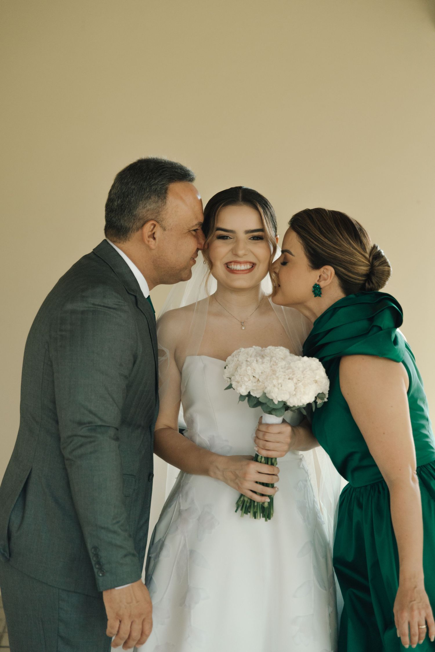 Emotional wedding scene with family members sharing an intimate moment.
