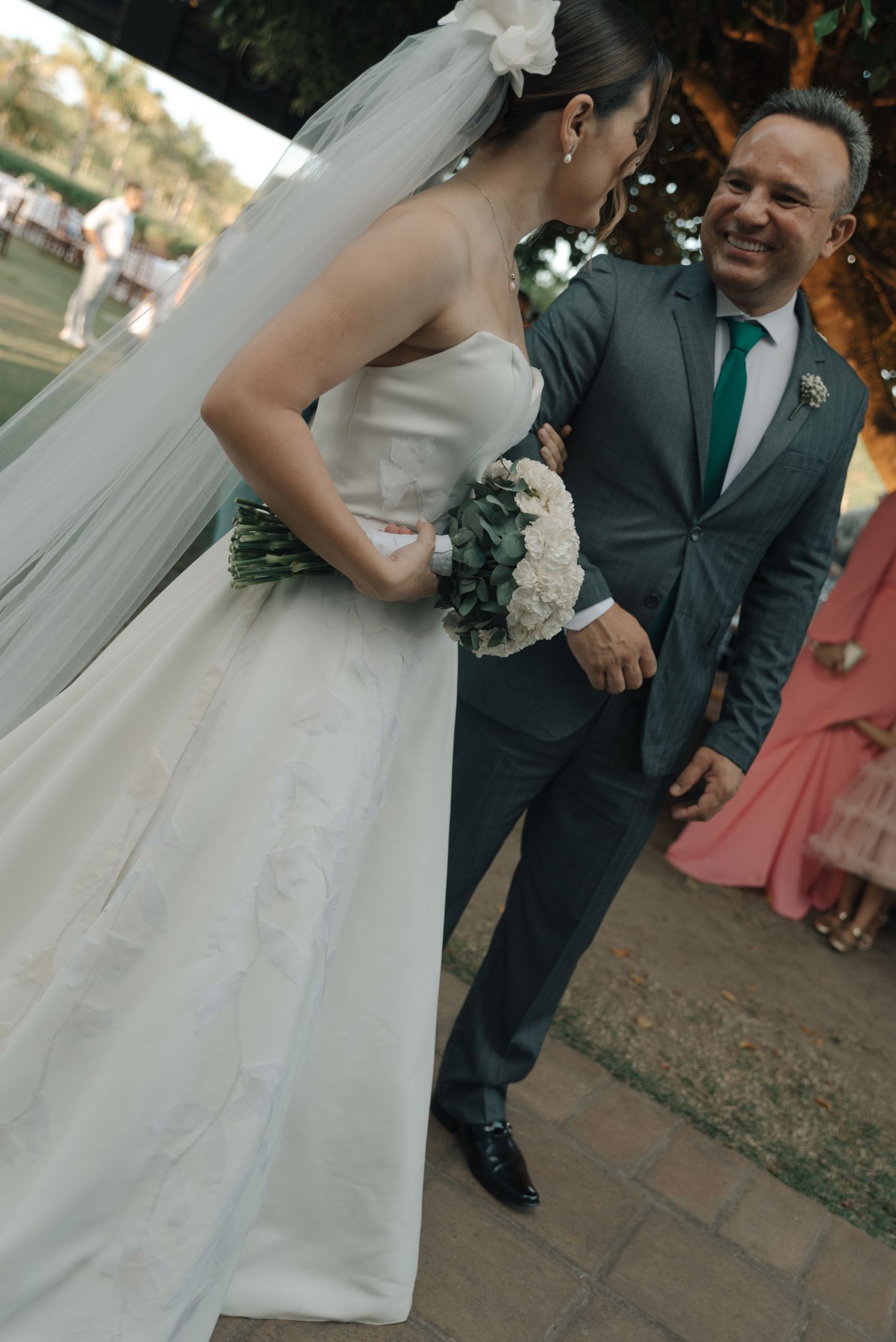 A couple sharing a joyful moment during their outdoor wedding ceremony.