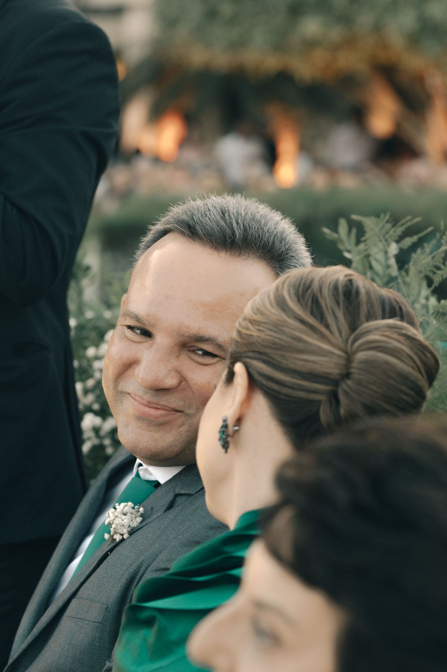 Wedding guests enjoying an intimate outdoor celebration.