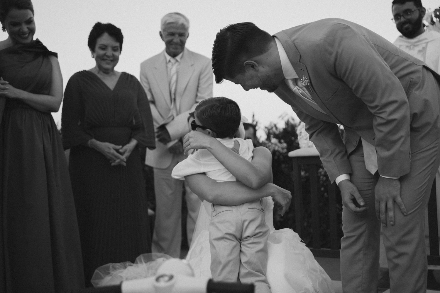 An emotional moment shared between wedding guests during the celebration.