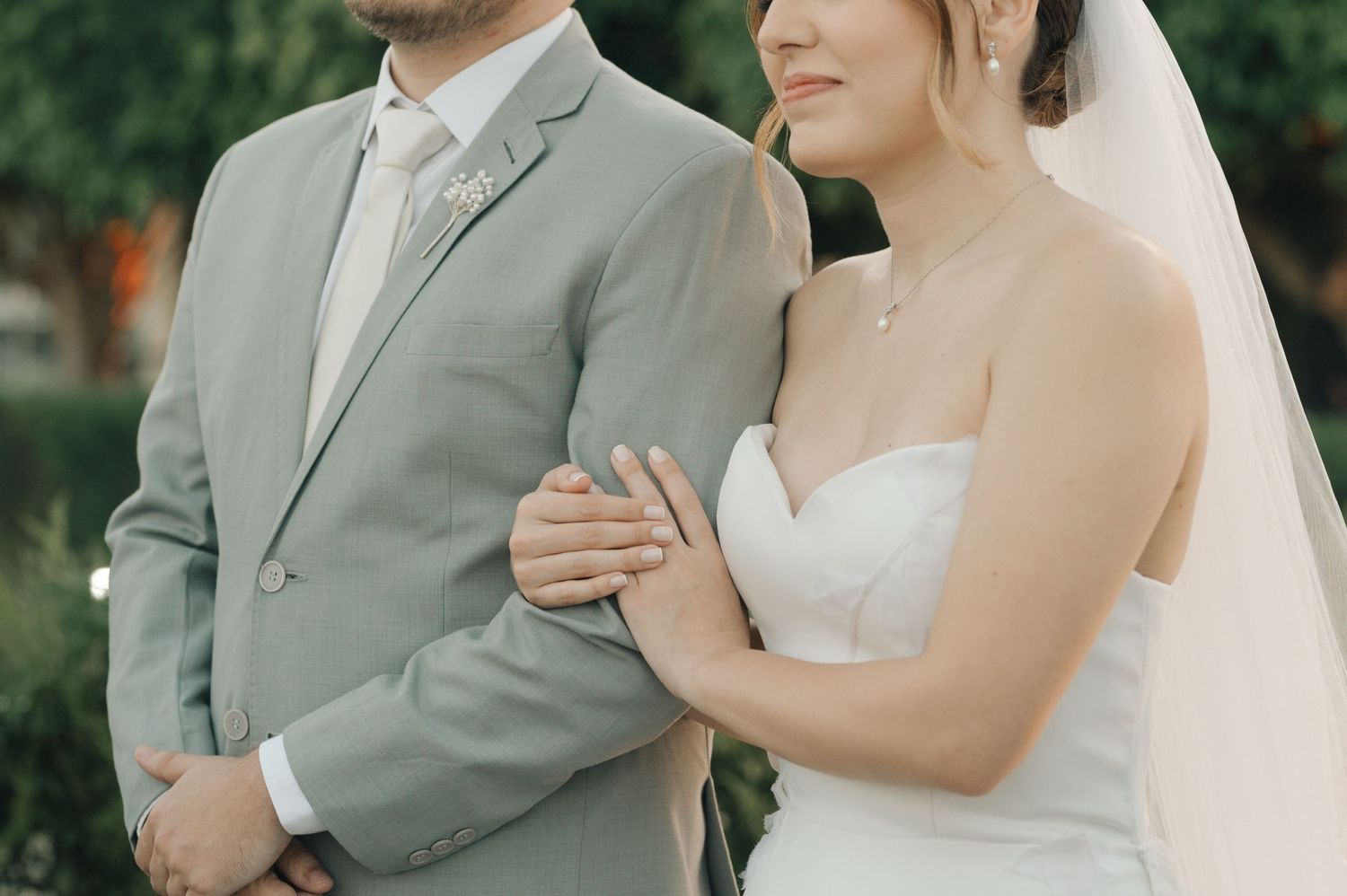 A couple in wedding attire share an intimate moment together.
