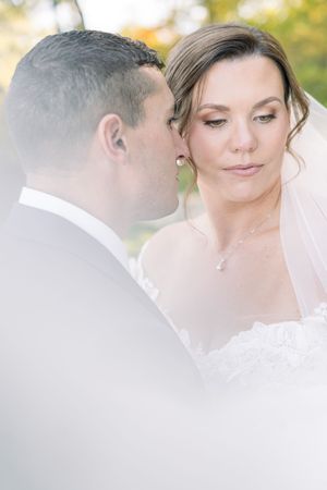Romantic close-up wedding portraits showing tender moments between newlyweds in soft natural lighting.