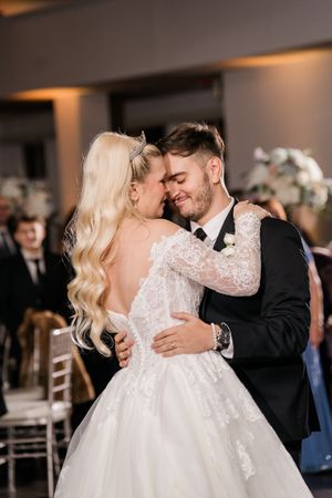 Romantic wedding dance sequence showing tender moments between newlyweds in an elegant reception venue.