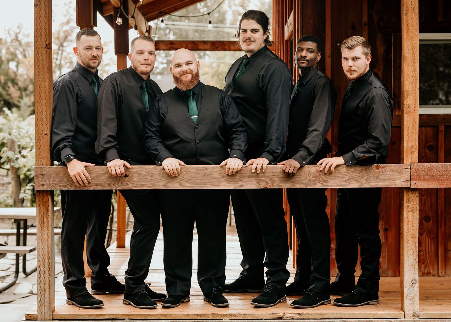 groom with groomsmen outside of Sugar Pine Barn